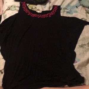 A black t shirt with pink flowers